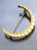 Antique Pearl Crescent Brooch set with graduating Pearls in an unmarked Gold setting approx 39mm