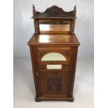 Antique cupboard with carved detailing, bevel edged mirrors and gallery above, approx 53cm x 36cm