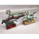Three Chinese Bronze sculptures including Flying Horse of Gansu each on wooden plinths, two horses