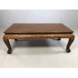 Coffee table with Eastern carved detailing, approx 105cm x 50cm x 40cm tall