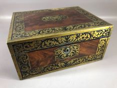 Brass bound writing box opening to reveal green leather writing slope and letter holder, with