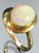 9ct Gold ring set with a Opal Gemstone, Oval approx 10 x 8.4mm, fully hallmarked approx size 'M'