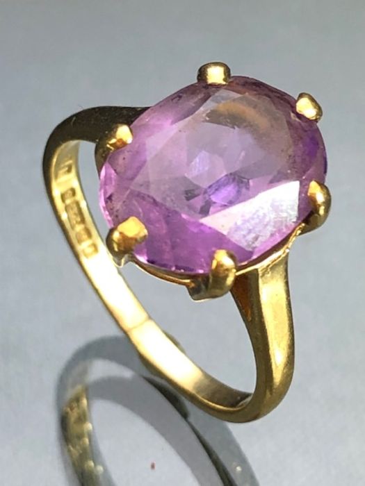 Large Oval faceted Amethyst approx 11.8mm x 9mm set with six good claws on 9ct Gold approx size '