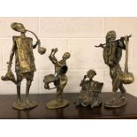 Set of four heavy brass African figures, the tallest approx 36cm in height