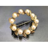 Gold coloured Laurel wreath design Brooch set with ten pearls approx 35mm in diameter