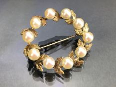 Gold coloured Laurel wreath design Brooch set with ten pearls approx 35mm in diameter