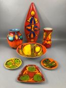 Collection of Poole Pottery Delphis pattern ceramics to include three sweet dishes, a shield