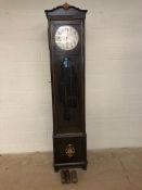 Grandfather clock with oval bevel edged glass window to movement, silvered dial with gold hands