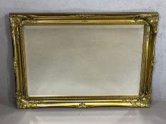 Modern gilt framed bevel edged mirror, approx 90cm x 64cm