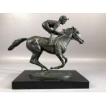 Bronze statue on black marble plinth entitled Champion Finish and signed by David Cornell 1985