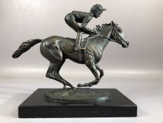 Bronze statue on black marble plinth entitled Champion Finish and signed by David Cornell 1985