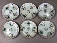 Set of six Famile Vert plates with red character marks to bases