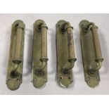 Four antique brass door pulls, each approx 30cm in length