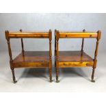 Pair of side tables with pull-out shelves, drawers under, on turned legs, with brass castors