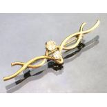 Fully hallmarked 9ct 375 Gold Brooch of twisted design and set with two good Diamonds in six claw