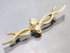 Fully hallmarked 9ct 375 Gold Brooch of twisted design and set with two good Diamonds in six claw