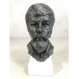 Plaster bust of a gentleman's head, painted black, on a white base, approx 45cm tall