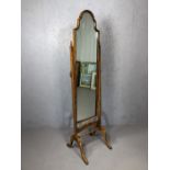 Antique cheval mirror with turned stretcher and carved detailing, approx 164cm x 40cm