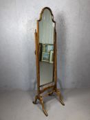 Antique cheval mirror with turned stretcher and carved detailing, approx 164cm x 40cm