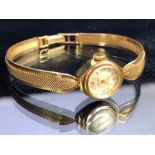 Baume wristwatch in 9ct Gold with 9ct gold strap, 17 jewels with silver coloured circular face