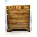 Brass bound campaign chest of seven drawers with brass flush circular handles, approx 77cm x 46cm