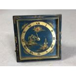 Japanese brass square faced clock with landscape scene to face and dial with Roman numerals,