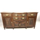 Mahogany carved sideboard on turned legs with carved leaf design and brass handles, approx 178cm x