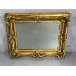 Antique French ornate gilt framed mirror, glass with foxing, approx 79cm x 98cm