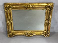 Antique French ornate gilt framed mirror, glass with foxing, approx 79cm x 98cm