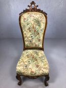 Carved wooden framed occasional chair with floral fabric upholstery, approx 110cm tall