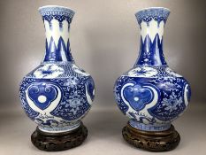 Two good size Chinese Blue and White baluster vases each with two blue circle marks to base and on