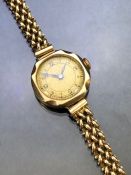 9ct Gold wristwatch with Gold case and 9ct Gold strap, circular face and circular link bracelet (