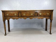 Antique Georgian sideboard with three drawers, brass handles and locks, approx 182cm x 48cm x 92cm