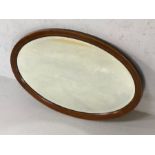 Edwardian oval bevel edged mirror with inlaid detailing, approx 76cm x 51cm