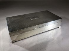 Silver hallmarked Art Deco Styled cigarette box on raised feet with wooden lining approx 16.5 x 8.