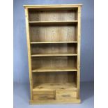 Light wood contemporary bookcase with adjustable shelves and two drawers under, approx 176cm x