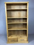 Light wood contemporary bookcase with adjustable shelves and two drawers under, approx 176cm x