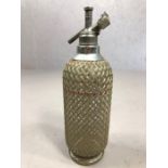 Vintage soda syphon with silver coloured metal grille marked Sparklets Ltd. London