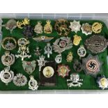 Military interest: Collection of cap badges and insignia, circa 33