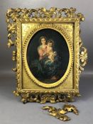 Oil painting of a Madonna and child in oval gilt frame, inscription verso partly indistinct but