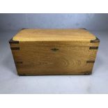 Light wood brass bound campaign chest, with brass handles, approx 65cm x 34cm x 34cm tall