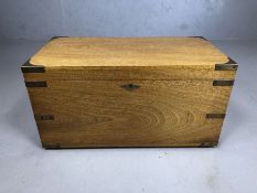 Light wood brass bound campaign chest, with brass handles, approx 65cm x 34cm x 34cm tall
