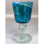 Mdina lustred turquoise glass wine goblet, etched to base and dated 1975, height approx 17cm