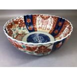 Japanese Imari bowl of circular fluted form, blue rim to base, approx 25cm in diameter