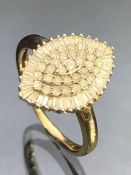 Unmarked yellow gold and Platinum diamond set marquise shaped cluster ring, size 'M', gross weight
