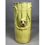 Ceramic glazed stick / umbrella stand, signed to base with raised dog head design, approx 48cm