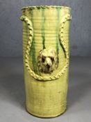 Ceramic glazed stick / umbrella stand, signed to base with raised dog head design, approx 48cm