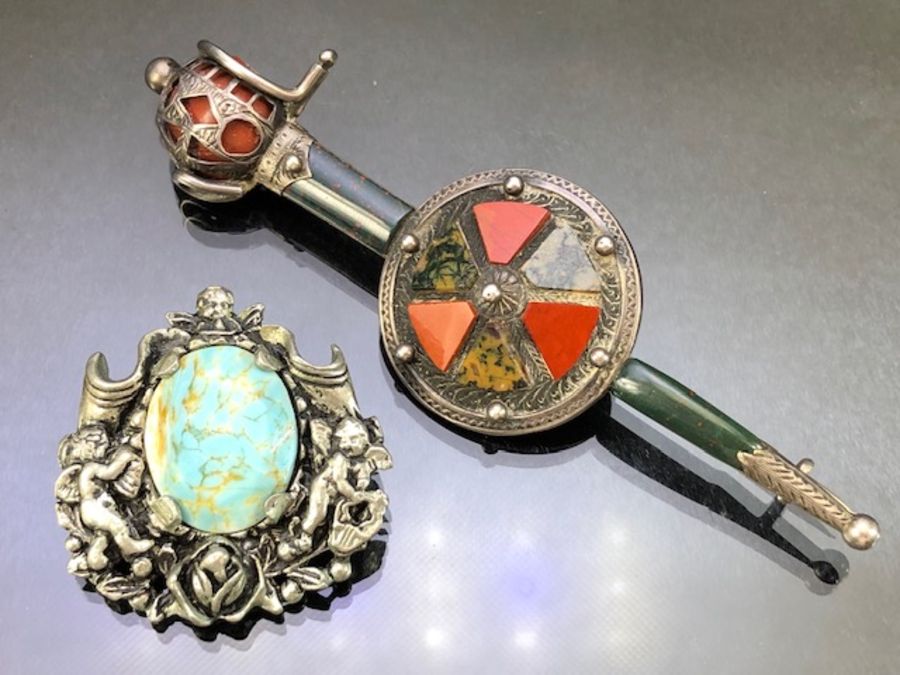 Silver Scottish Brooch set with stones in the form of a sword and shield and inscribed to the