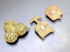 Artefacts: an (incomplete) copper alloy clog or shoe clasp inlaid in silver with floral pattern of