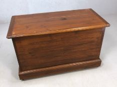 Pine stained storage box with hinged lid, brass handles, on castors, approx 85cm x 40cm x 56cm